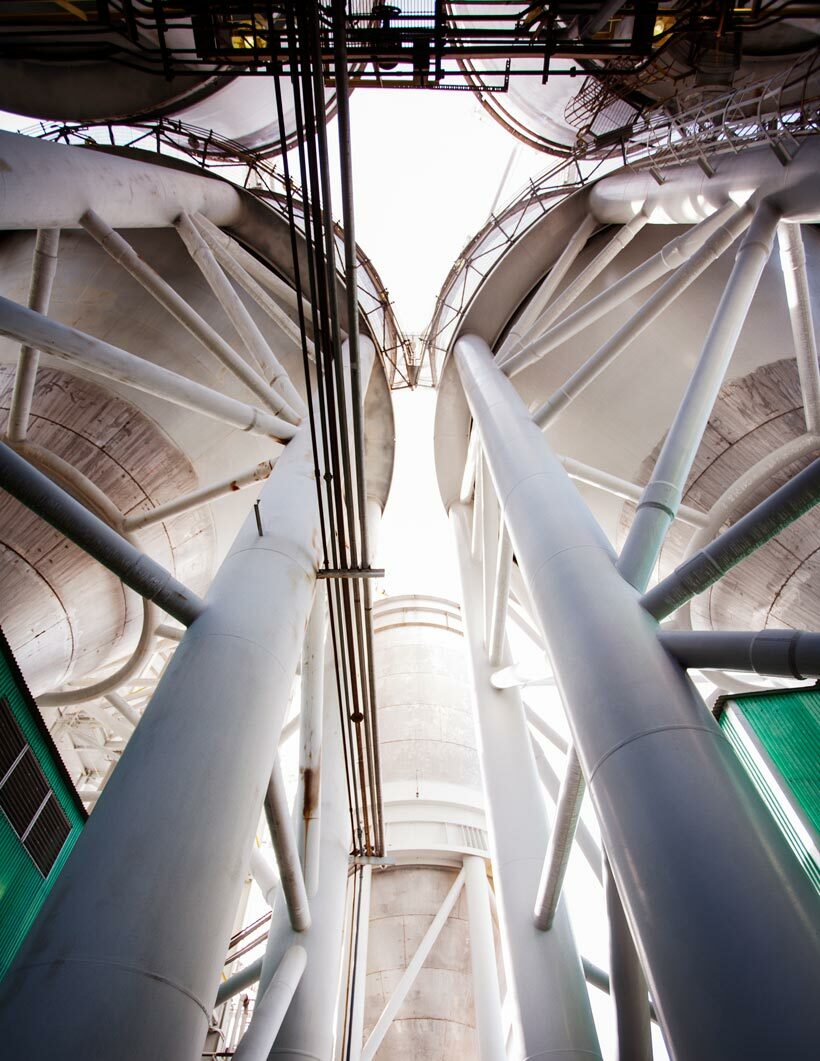 low angle view of storage tanks at oil refinery